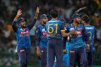 | Photo: AP/Eranga Jayawardena : Sri Lankan team members celebrate their win over India